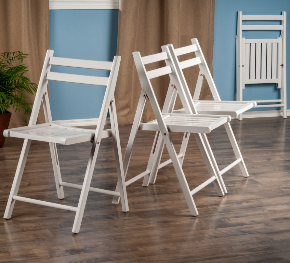 set of white wooden foldable chairs