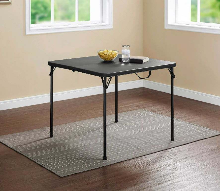 black square foldable dining table in open space