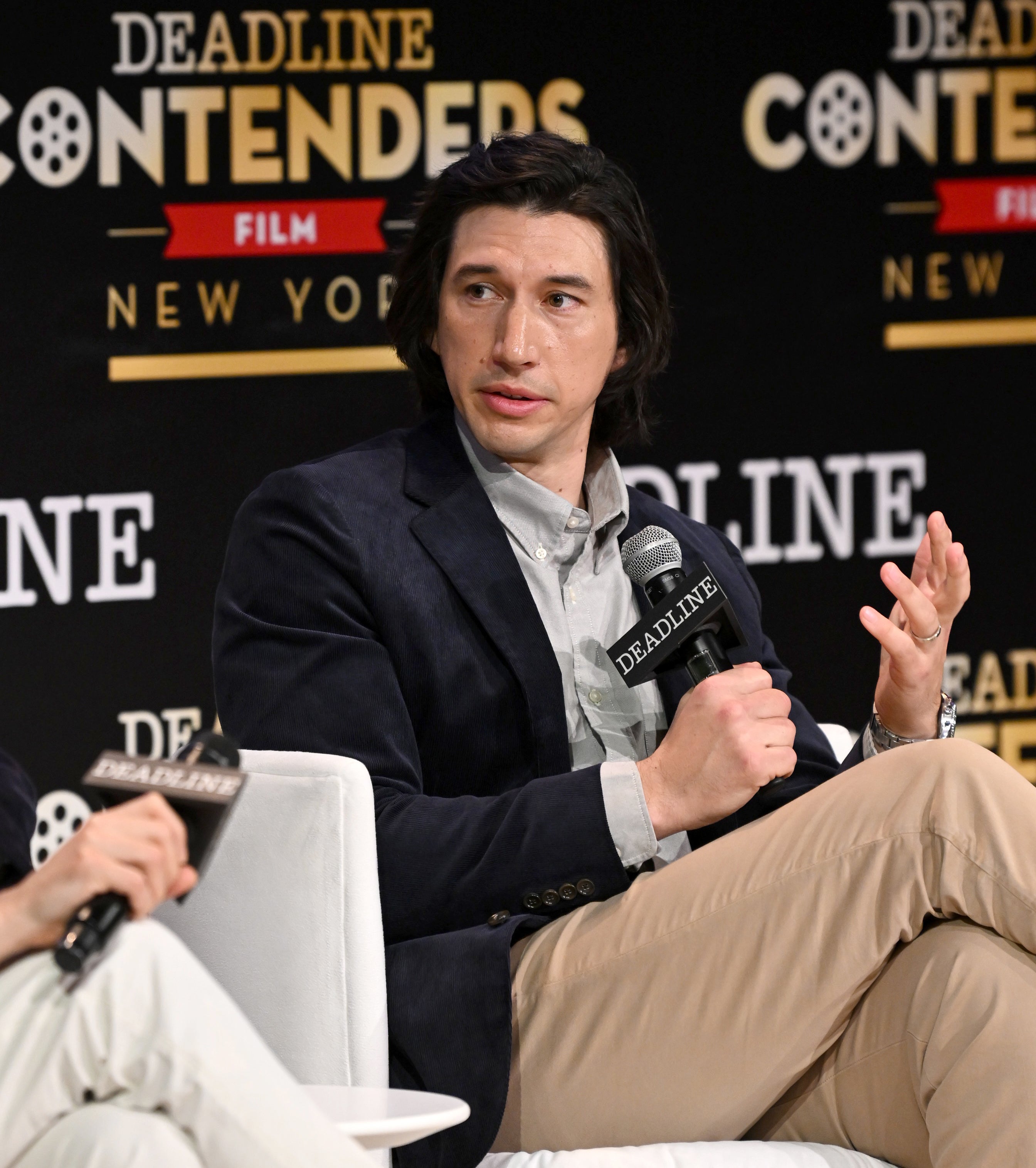 Closeup of Adam Driver sitting for a panel interview