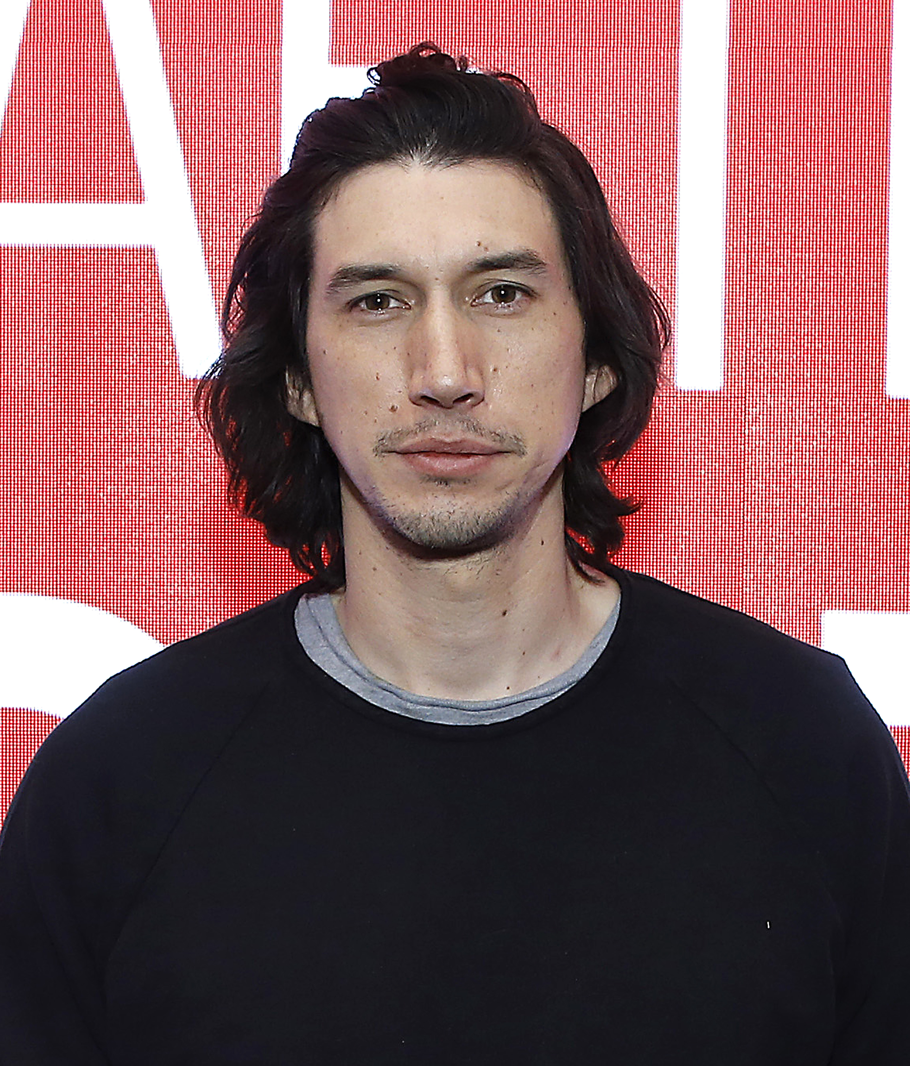 Closeup of Adam Driver on the red carpet dressed casually