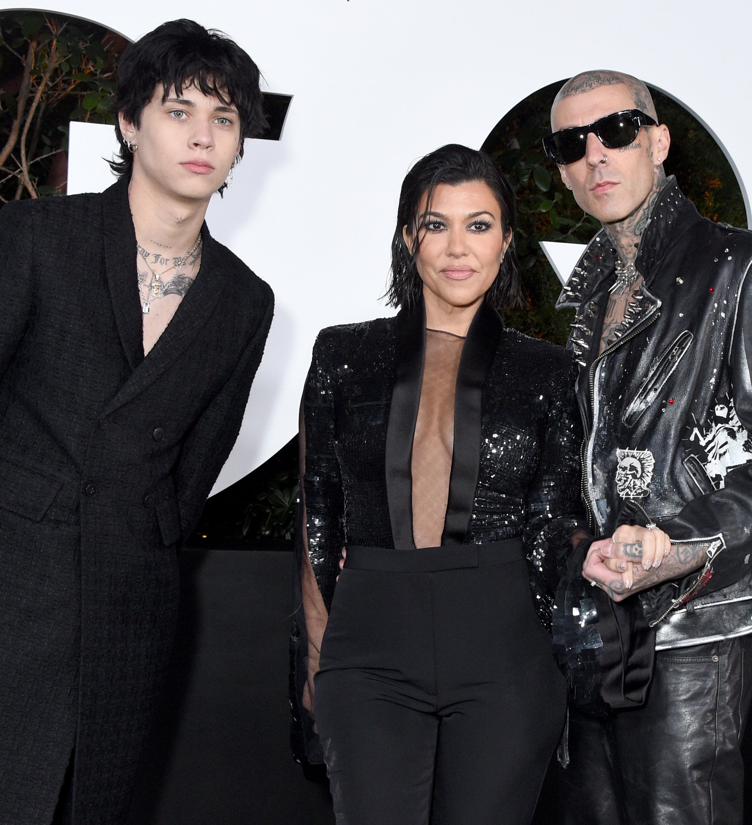 From left to right: Landon, Kourtney, and Travis at a media event