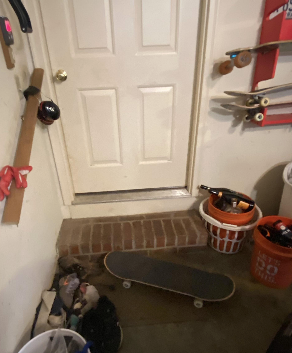 a skateboard next to an entrance