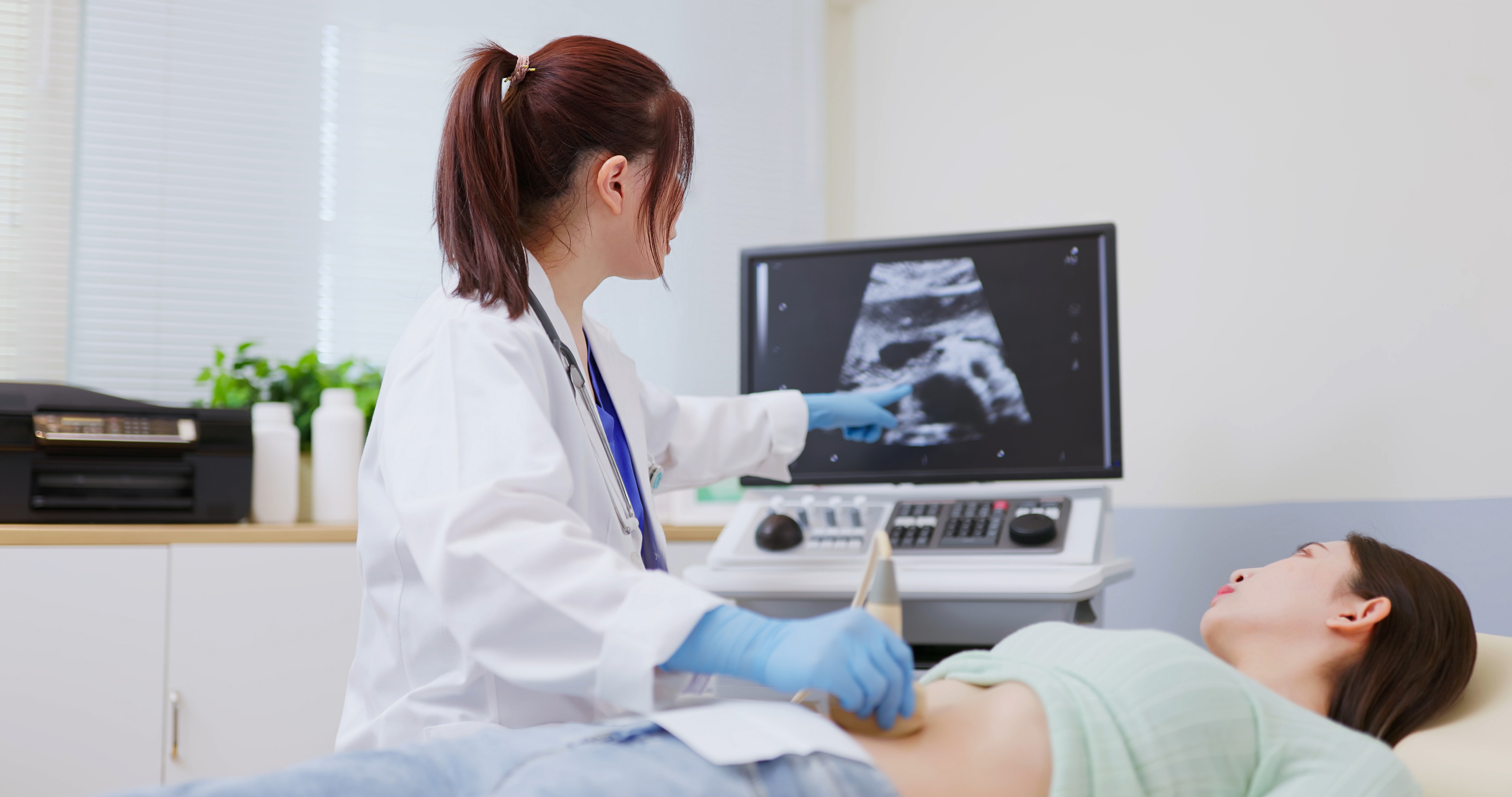 a woman performing an ultrasound