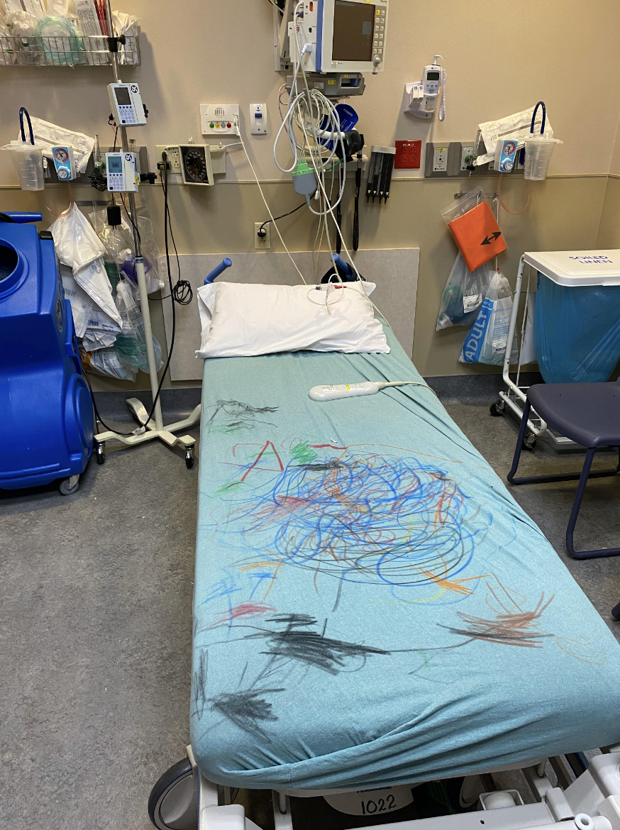 Kid&#x27;s drawings on a hospital bed