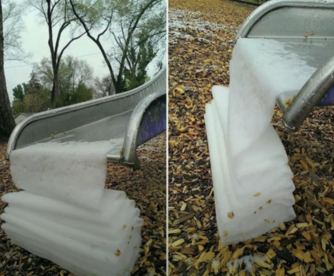 Snow falling off a slide in a continuous sheet