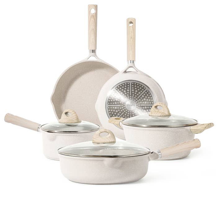 three pots and two pans with matching lids
