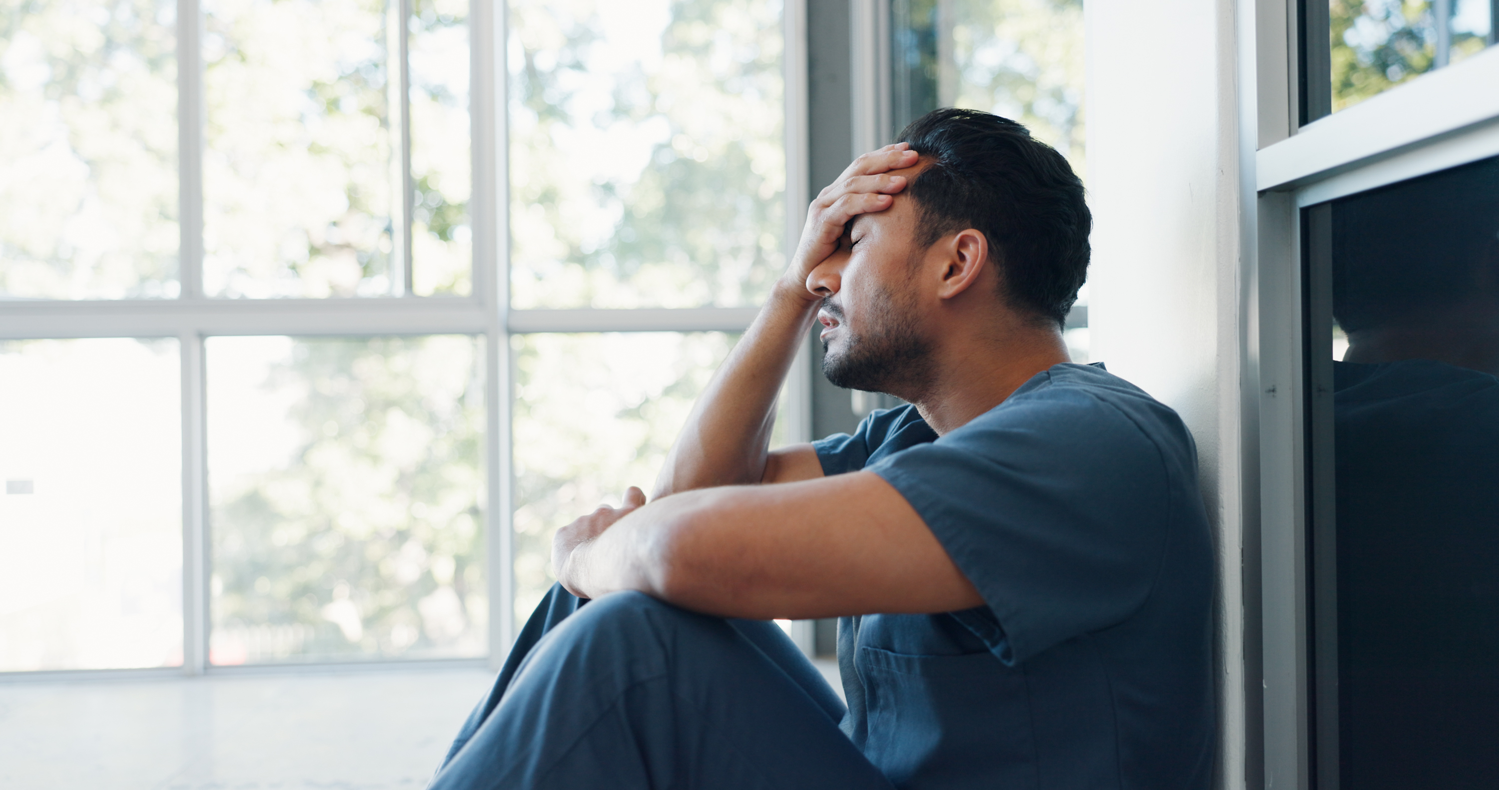 a frustrated nurse sitting on the ground