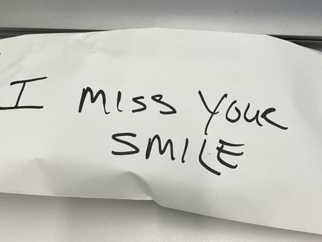 Envelope with &quot;I miss your smile&quot; handwritten on it