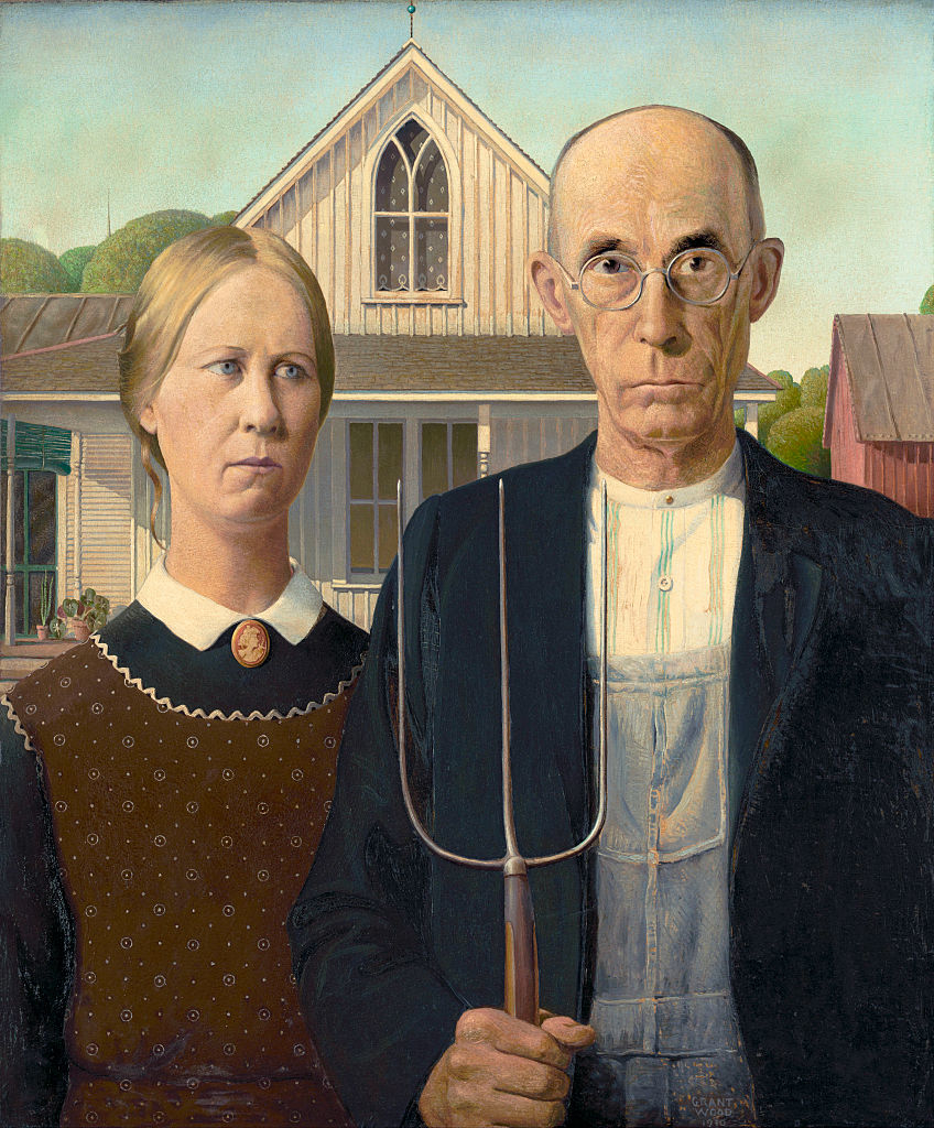 &quot;American Gothic,&quot; showing the stern woman and man, who&#x27;s holding a pitchfork