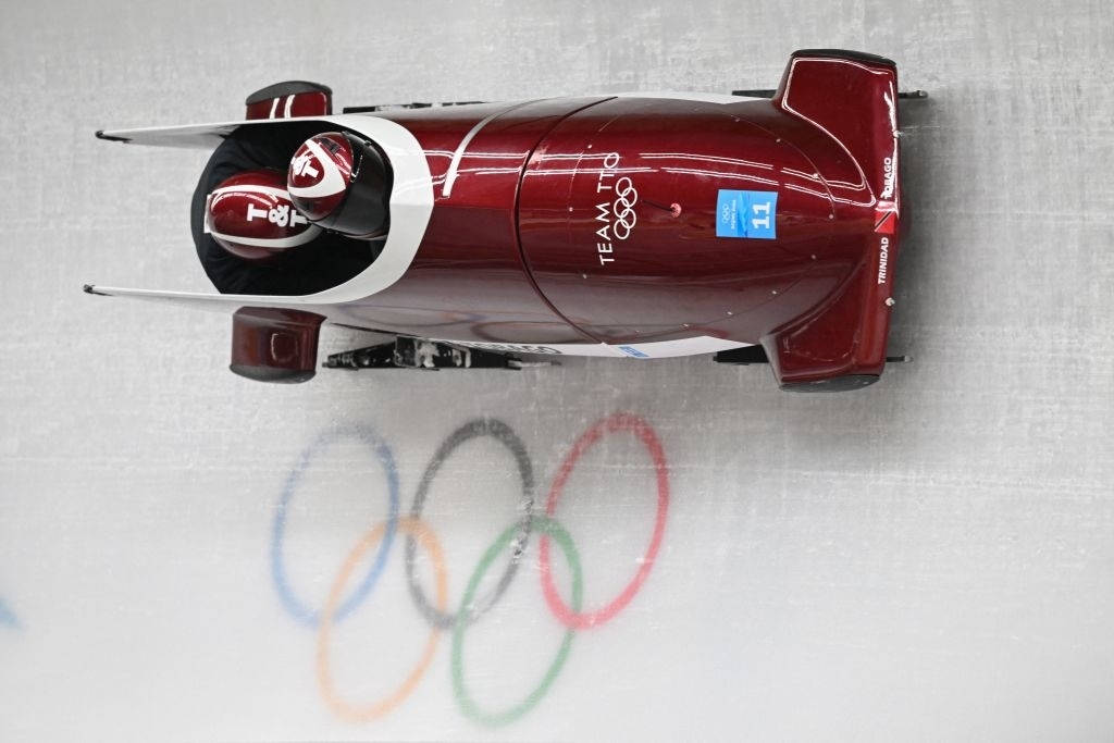 A bobsled at the Olympics on a track that&#x27;s perpendicular to the floor