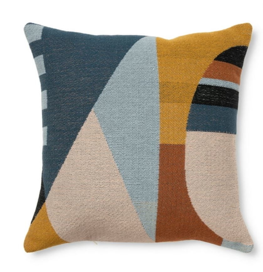 patterned and multi-colored throw pillow