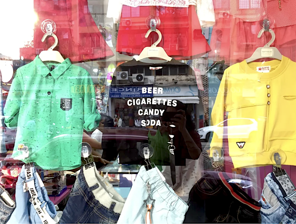 a kids shirt that says "beer, cigarettes, candy, soda"