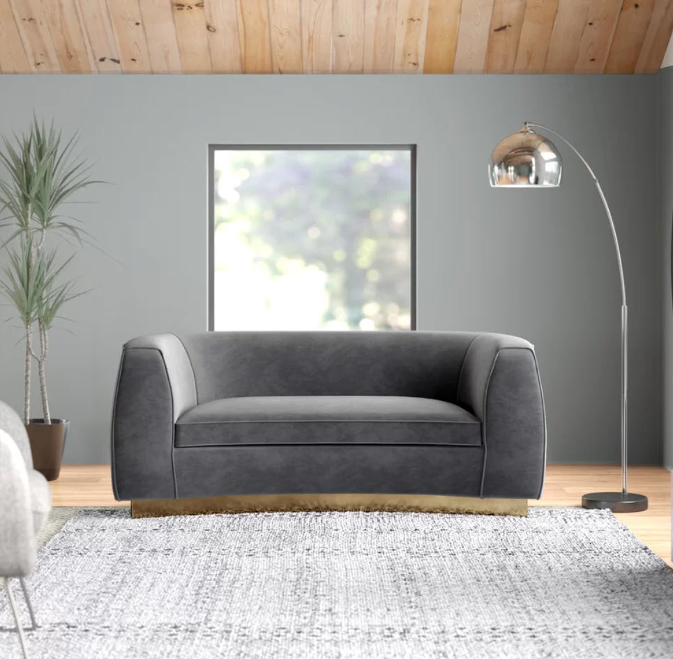 circular modern grey couch with gold base