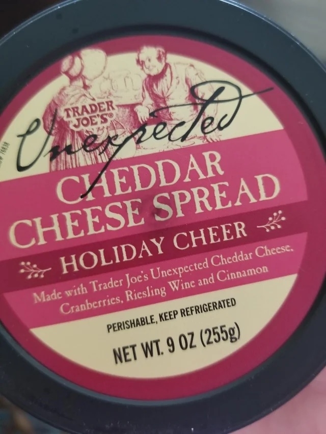 a package of Holiday Cheer Unexpected Cheddar Cheese Spread
