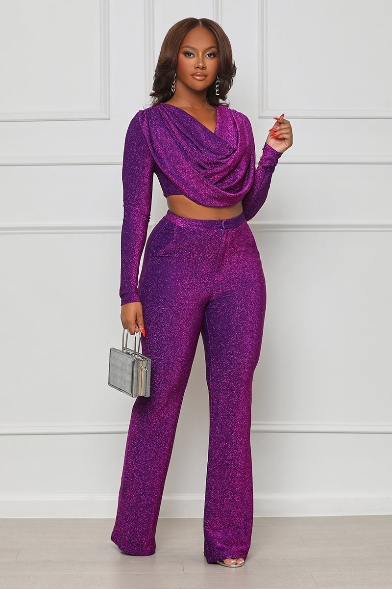 model wearing matching sparkly purple crop top and pants set