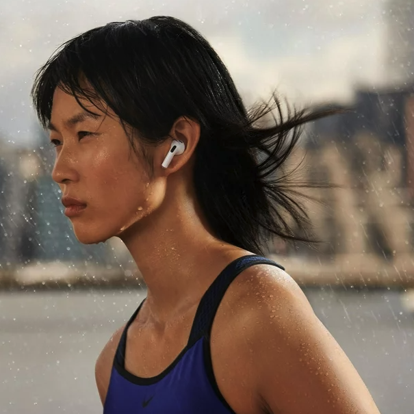 woman running with airpods