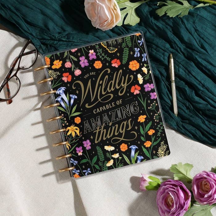 the planner that reads you are wildly capable of amazing things on the floral cover