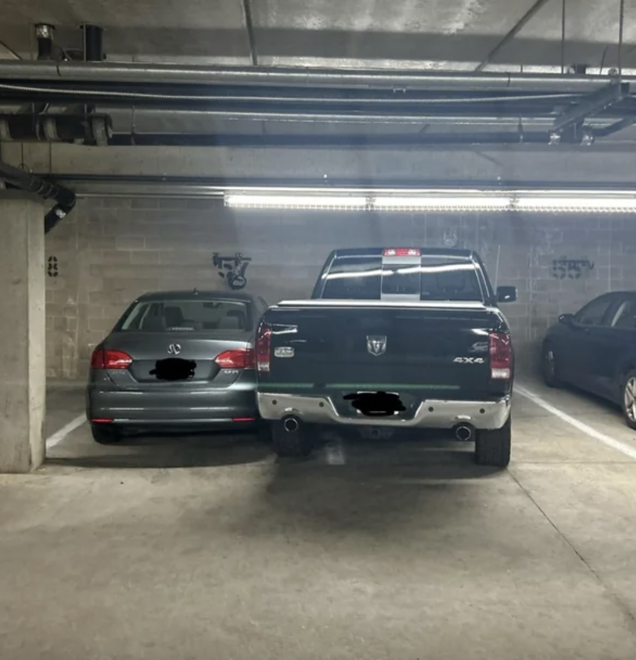 truck blocking a car into a spot