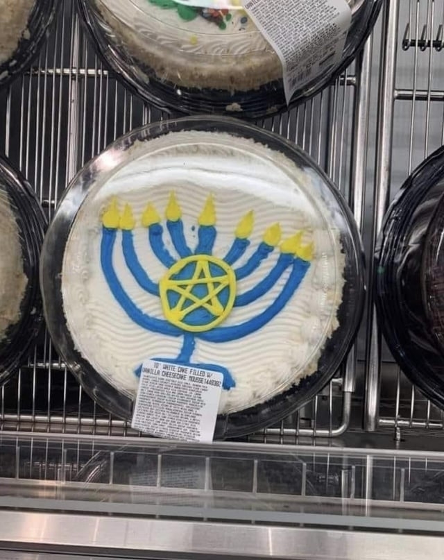 A cake with a pentagram over the menora