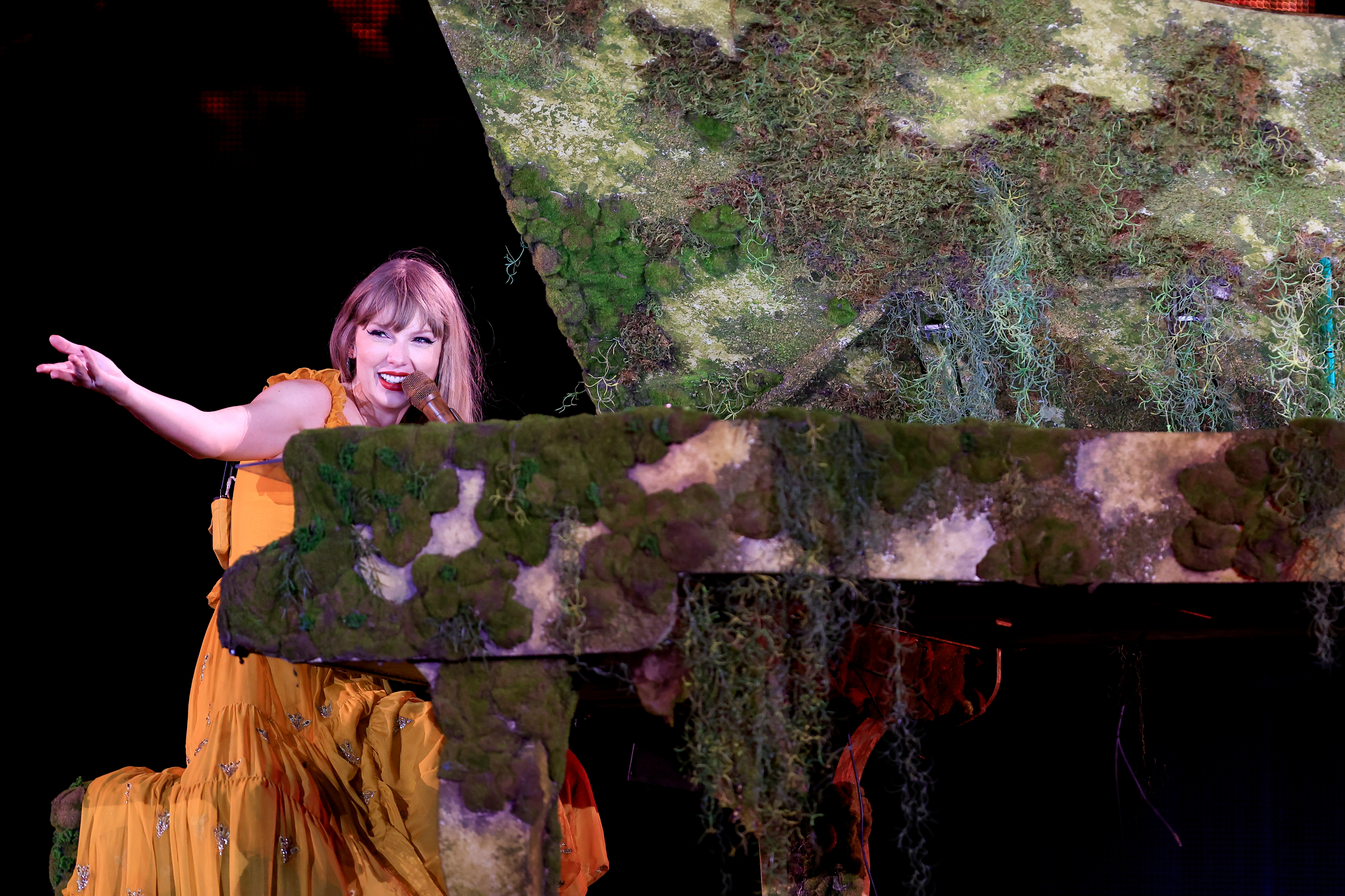 Taylor Swift onstage at the piano