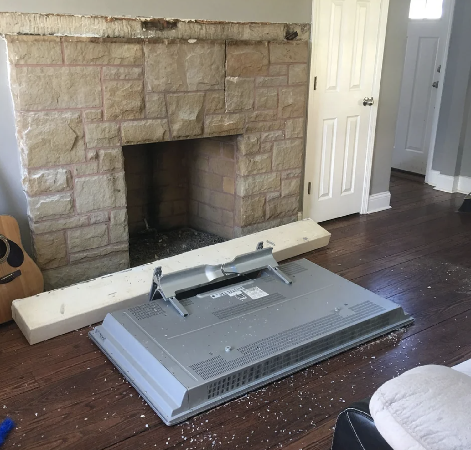 tv and the fireplace tile crashed on the floor