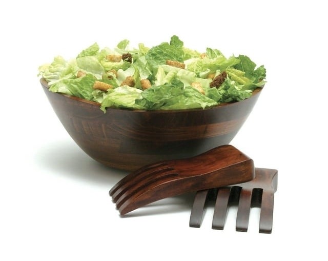 the salad bowl and salad hands on a white background