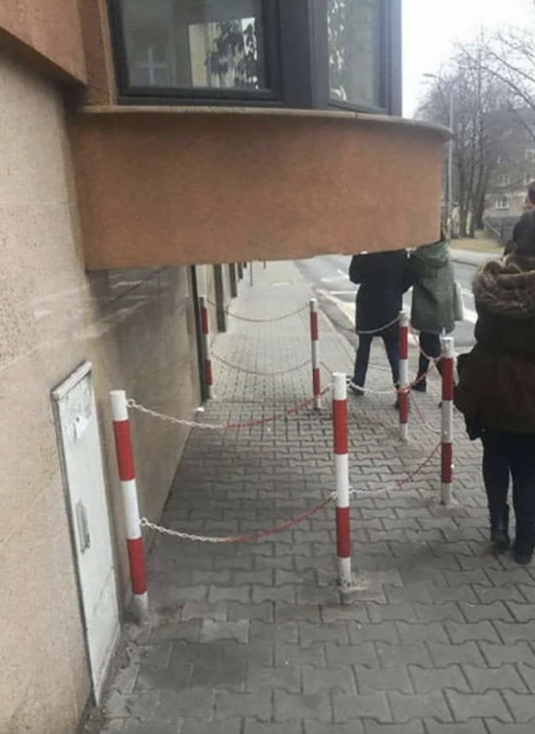warning poles around the balcony to warn pedestrians