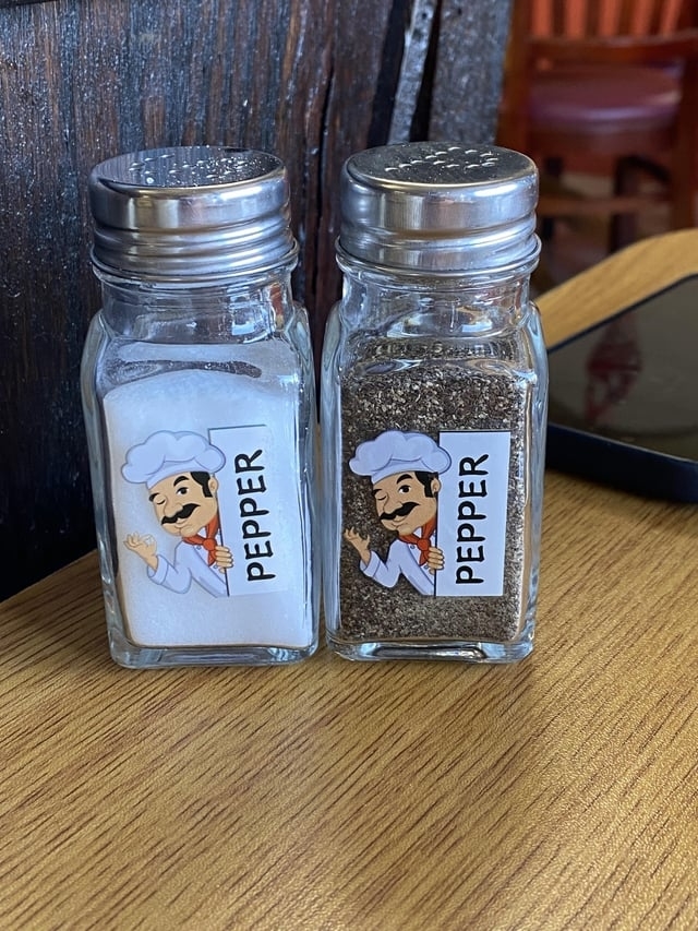 Salt and pepper shakers that both say "Pepper"