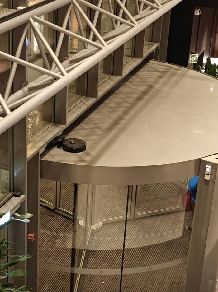 roomba on the roof above a set of swinging door