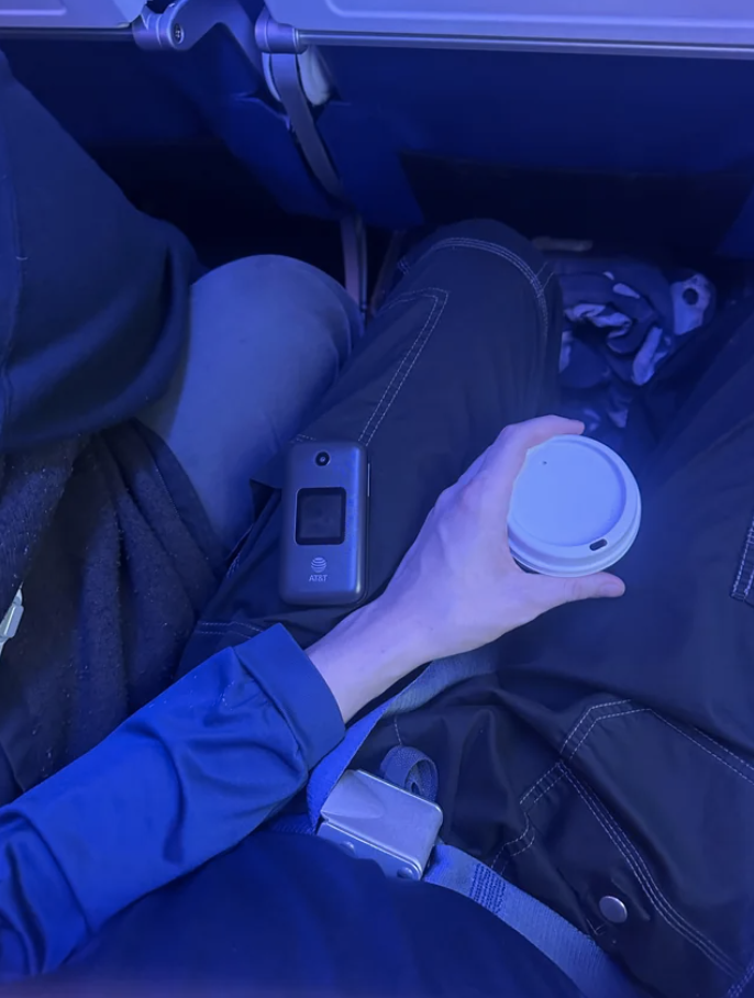 a phone on someone&#x27;s lap