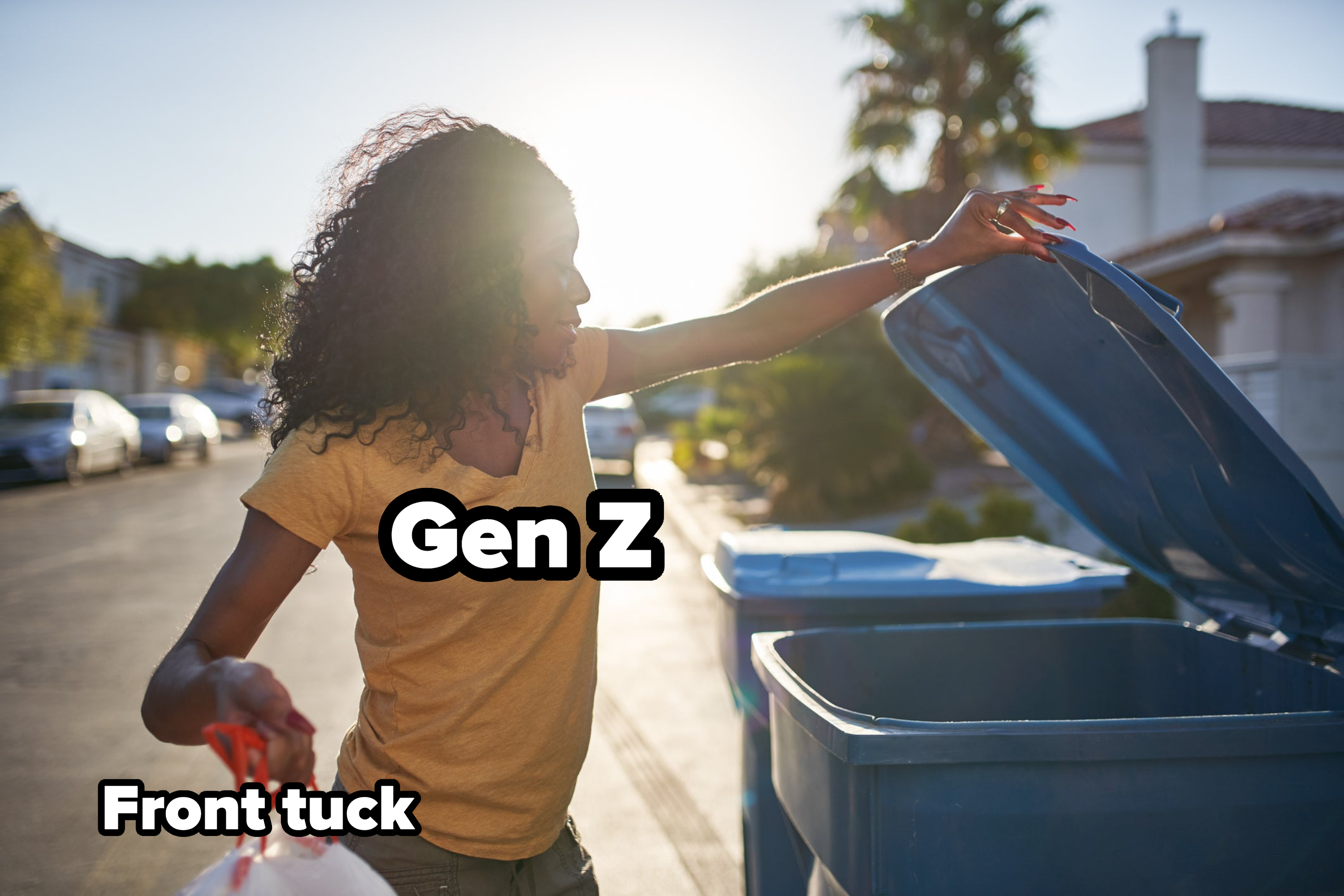 Woman taking out the trash in las vegas neighborhood during the day