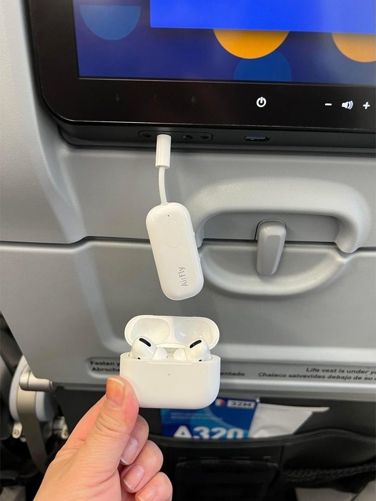 someone using the device on a plane so they can use their airpods