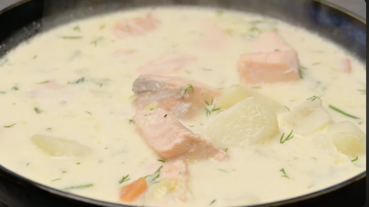 Creamy salmon soup cooking