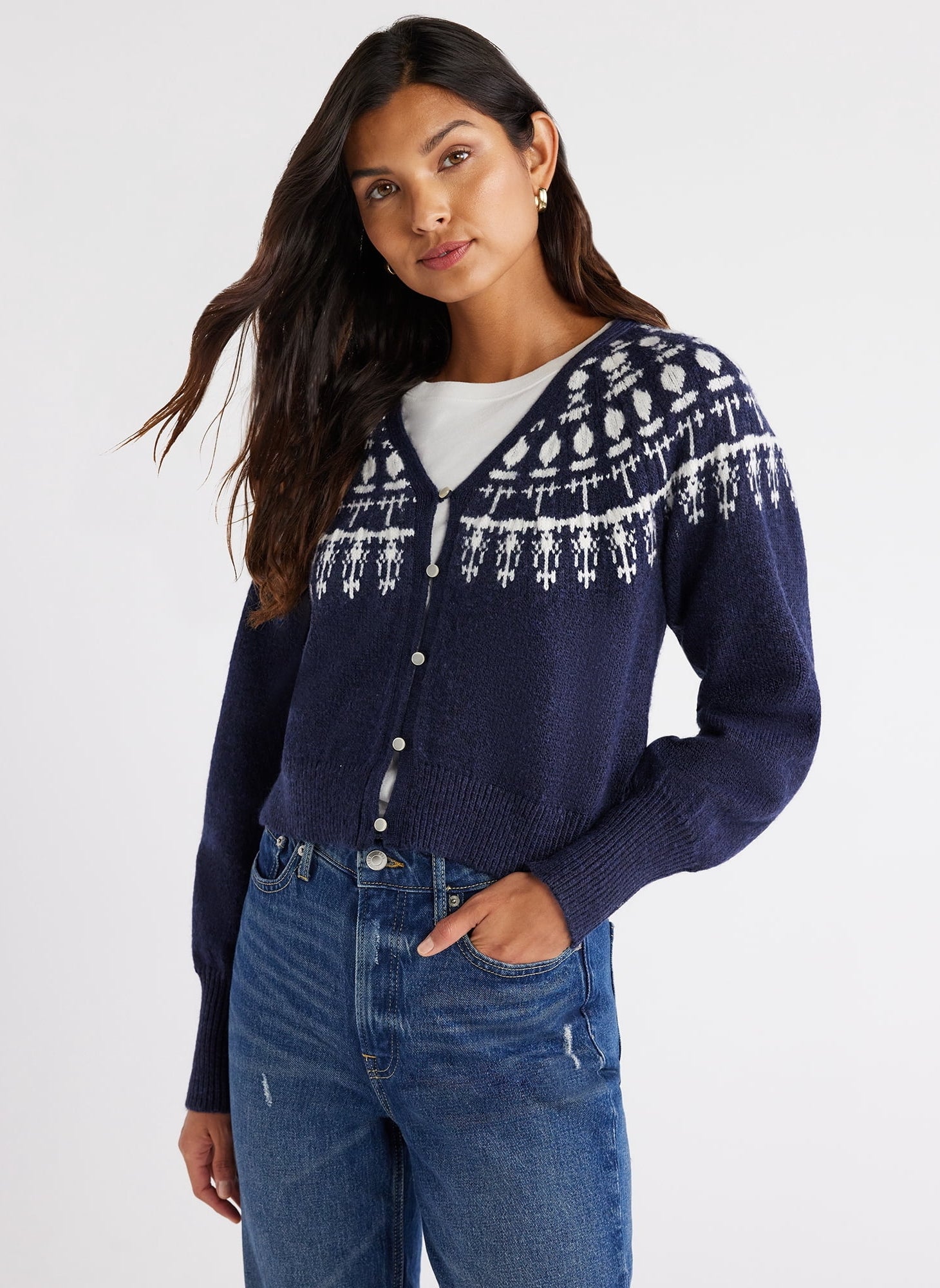 a model wearing the sweater in navy