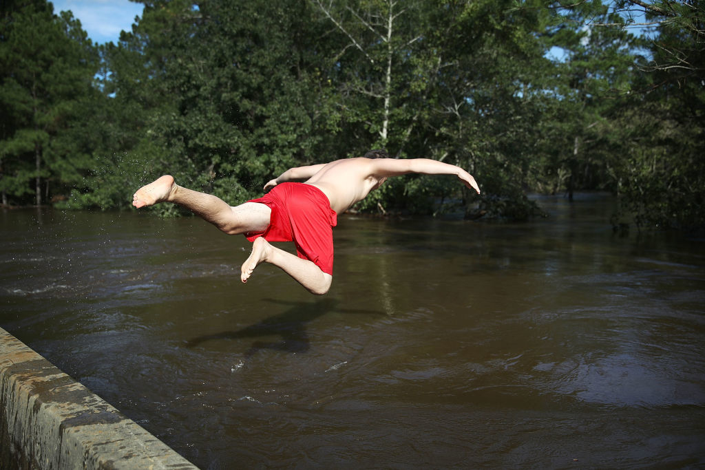 a person jumping into a river