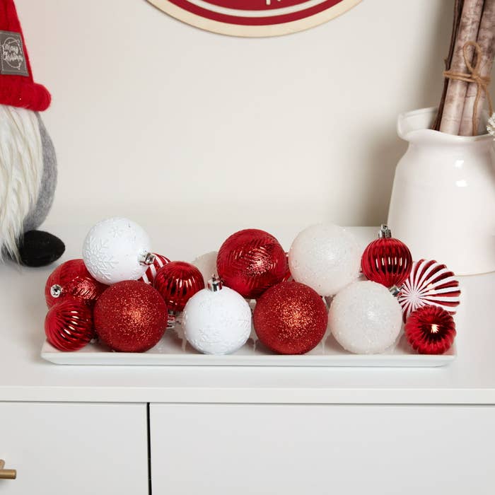 The balls on a shelf in red and white