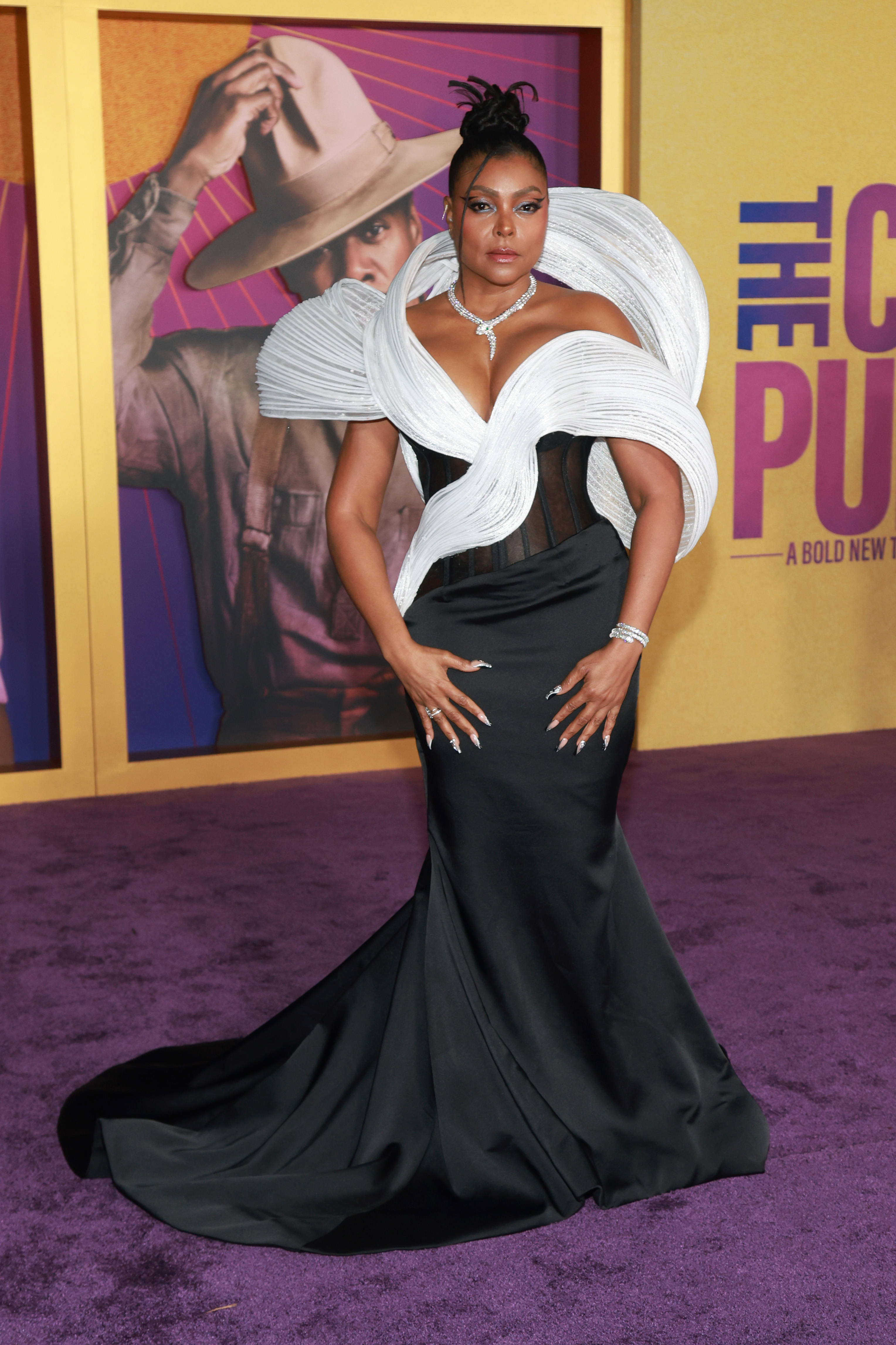 Taraji in a swirl-collar, sleeveless black-and-white gown with small train