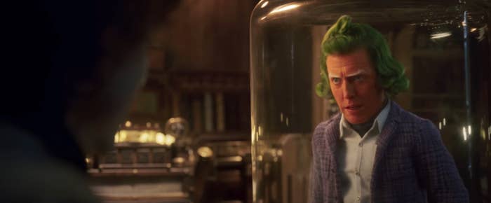 him in character behind glass