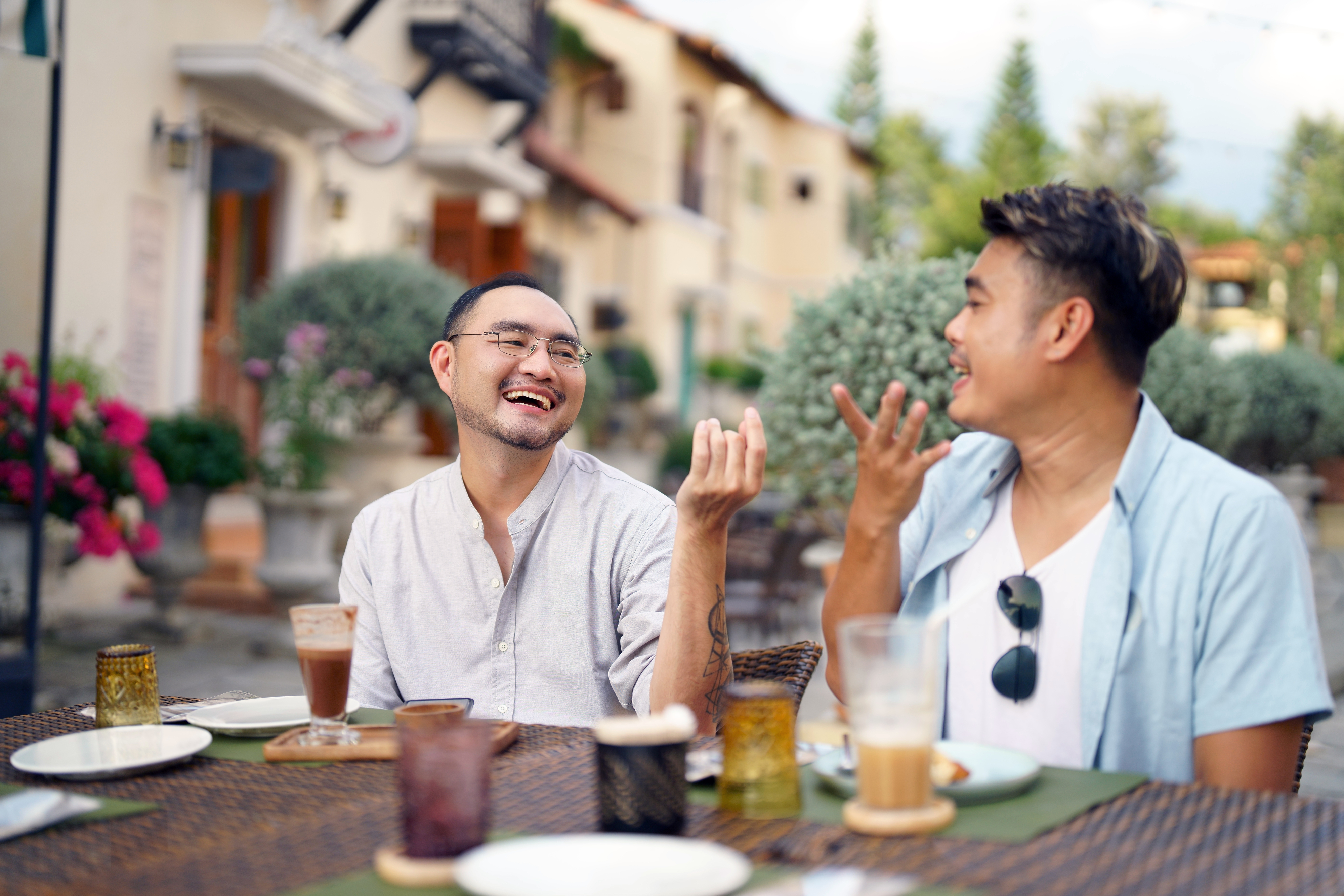 two people laughing at the table