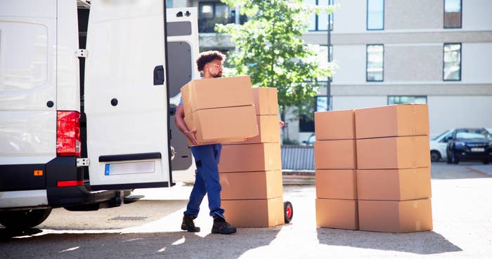 A person loading a truck with boxes