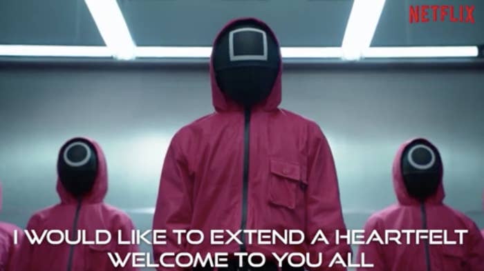 Screenshot from the series showing the guards in jumpsuits and &quot;I would like to extend a heartfelt welcome to you all&quot;