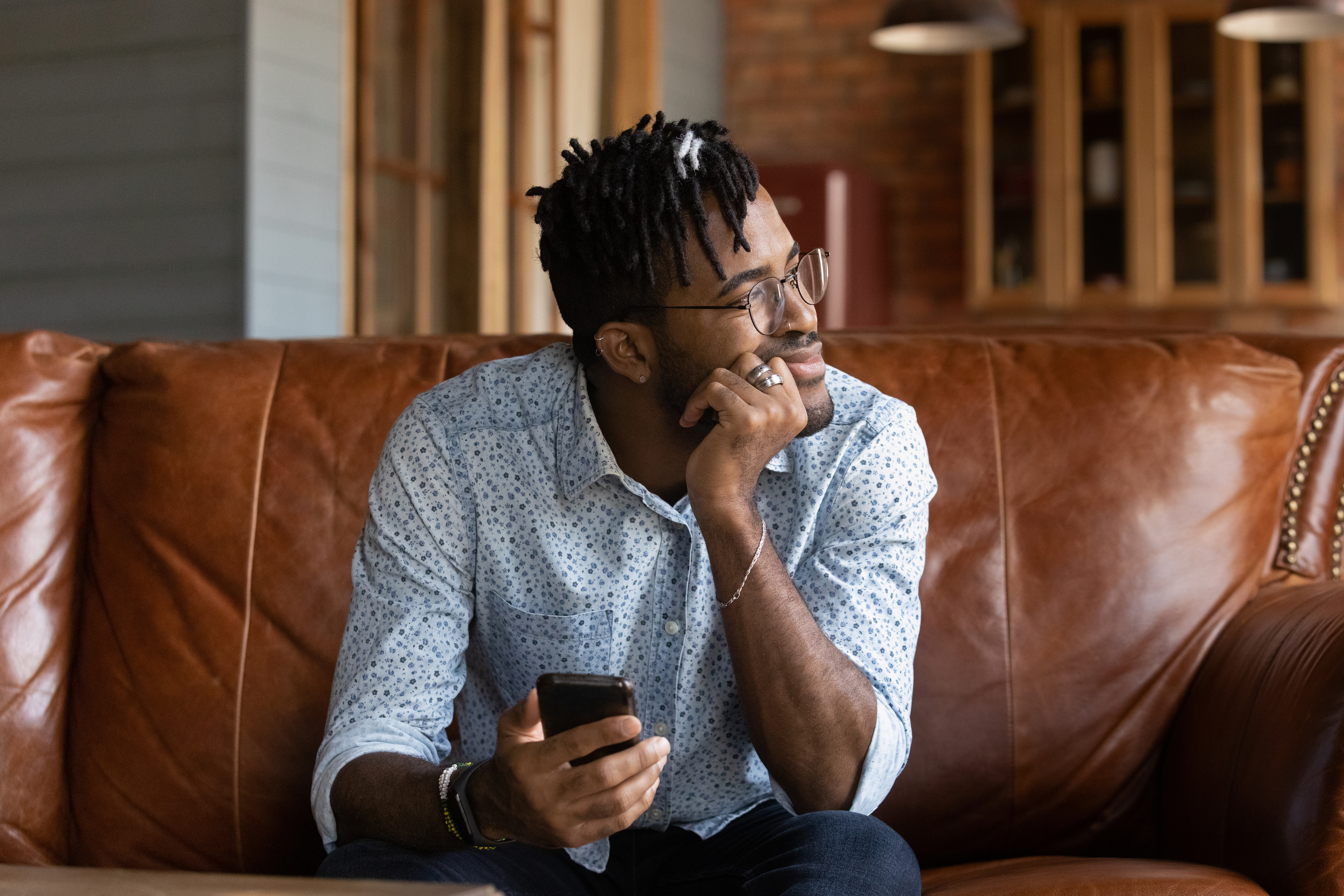 a person looking confused while holding phone