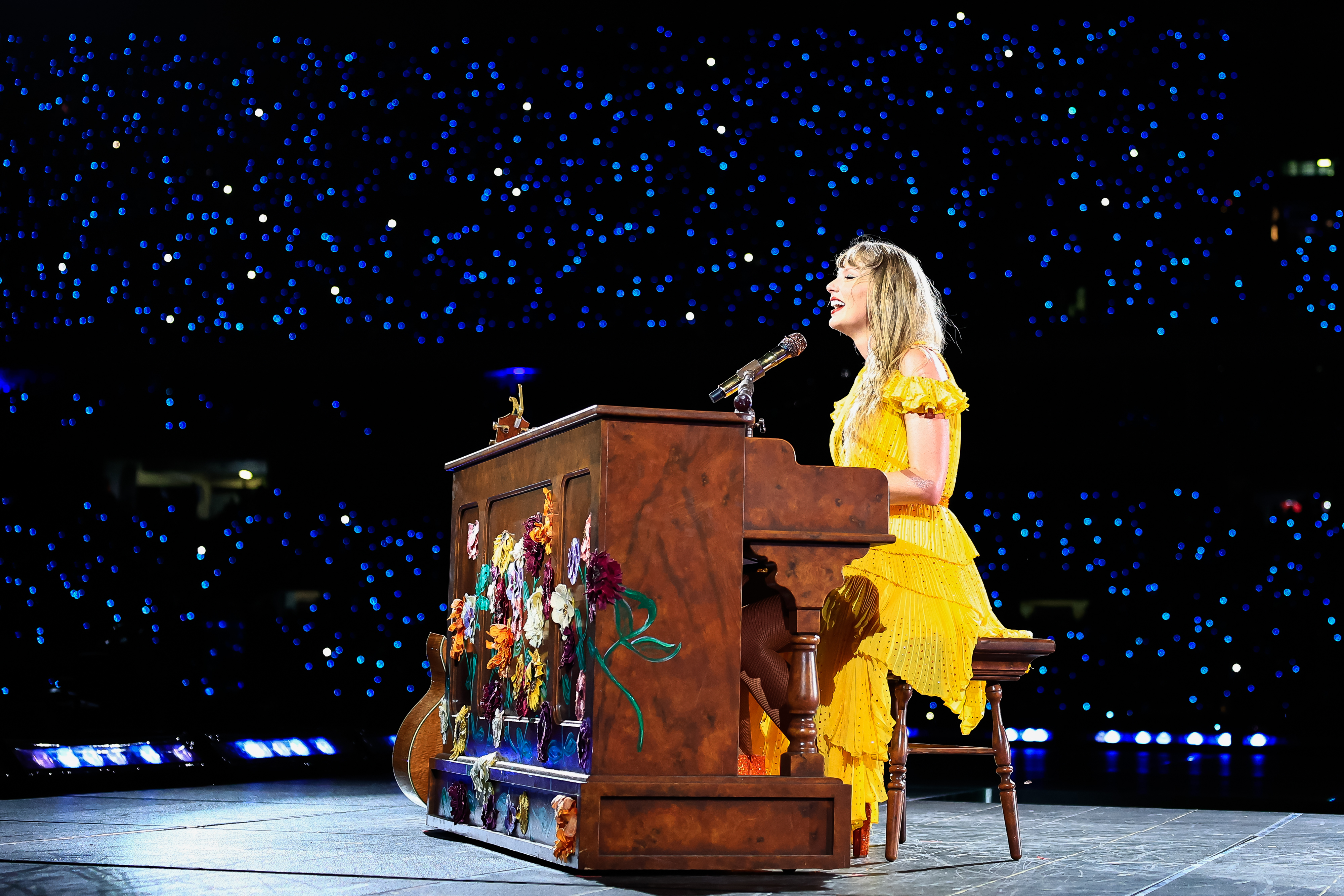taylor playing piano on stage