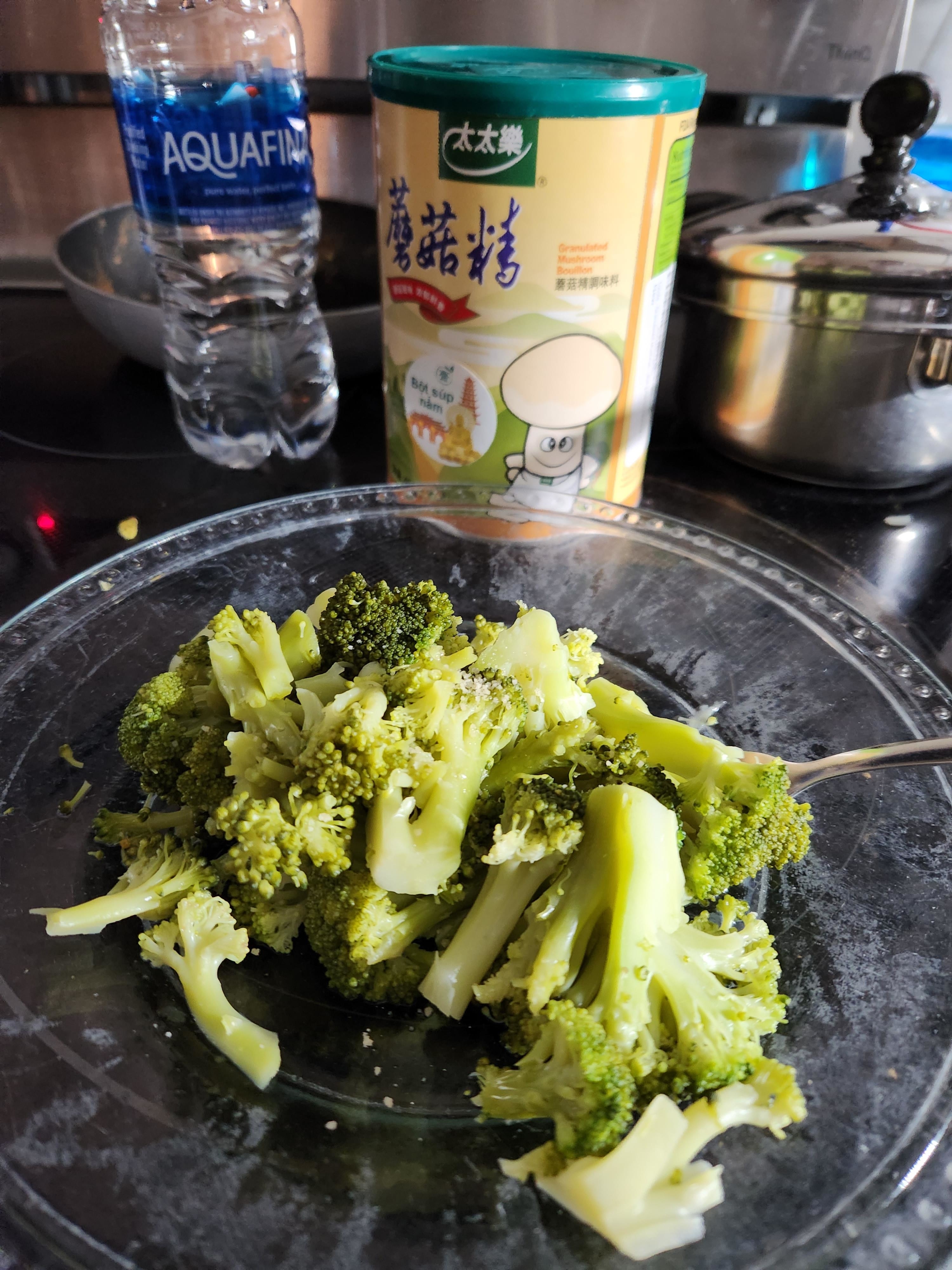 a plate of overcooked broccoli