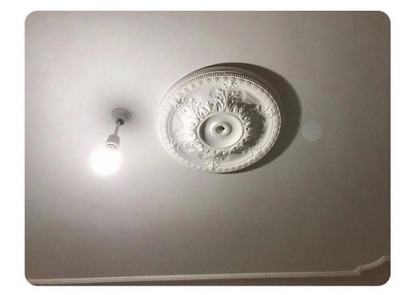 A light installed about six inches away from the light&#x27;s decorative fixture