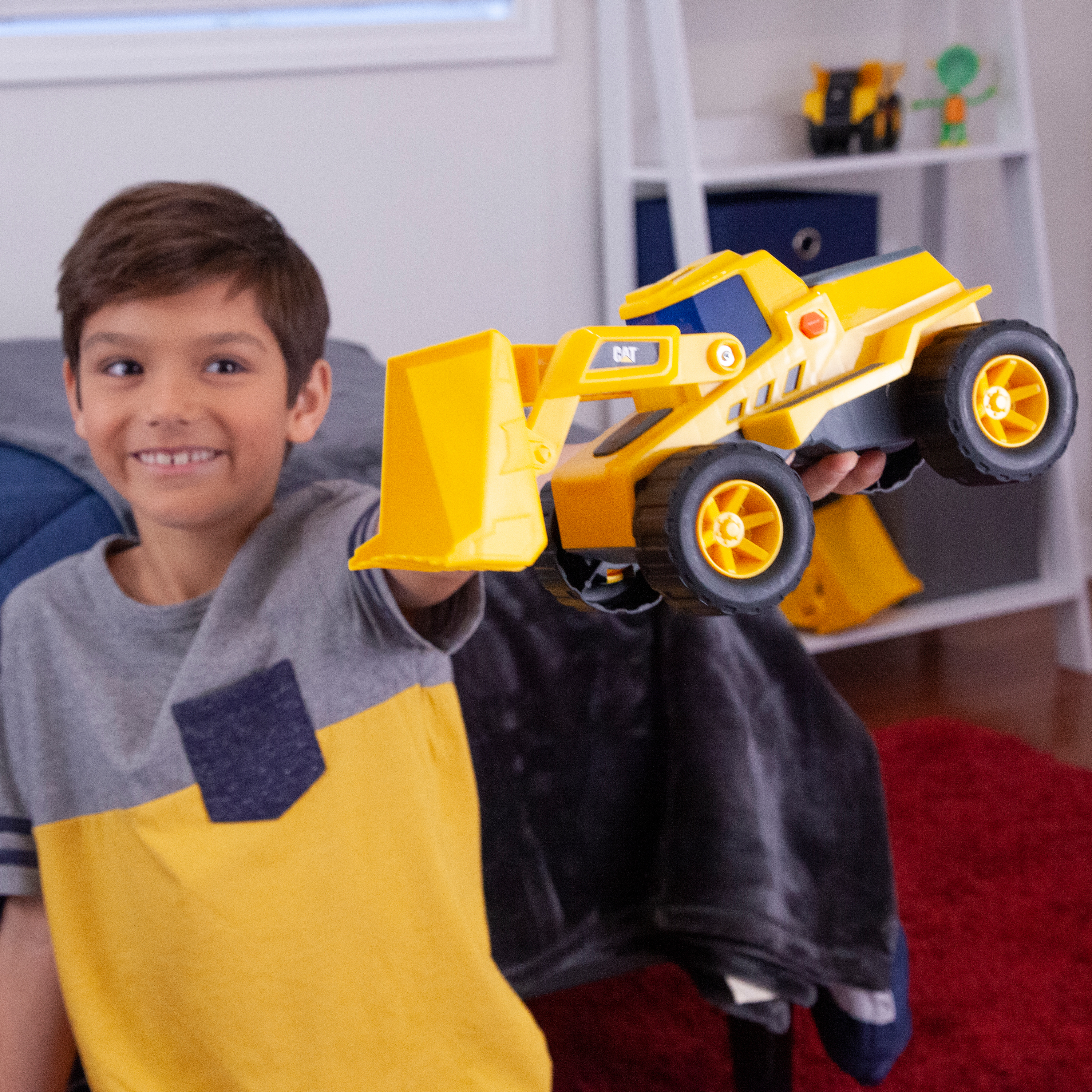 a child holding up the wheel loader