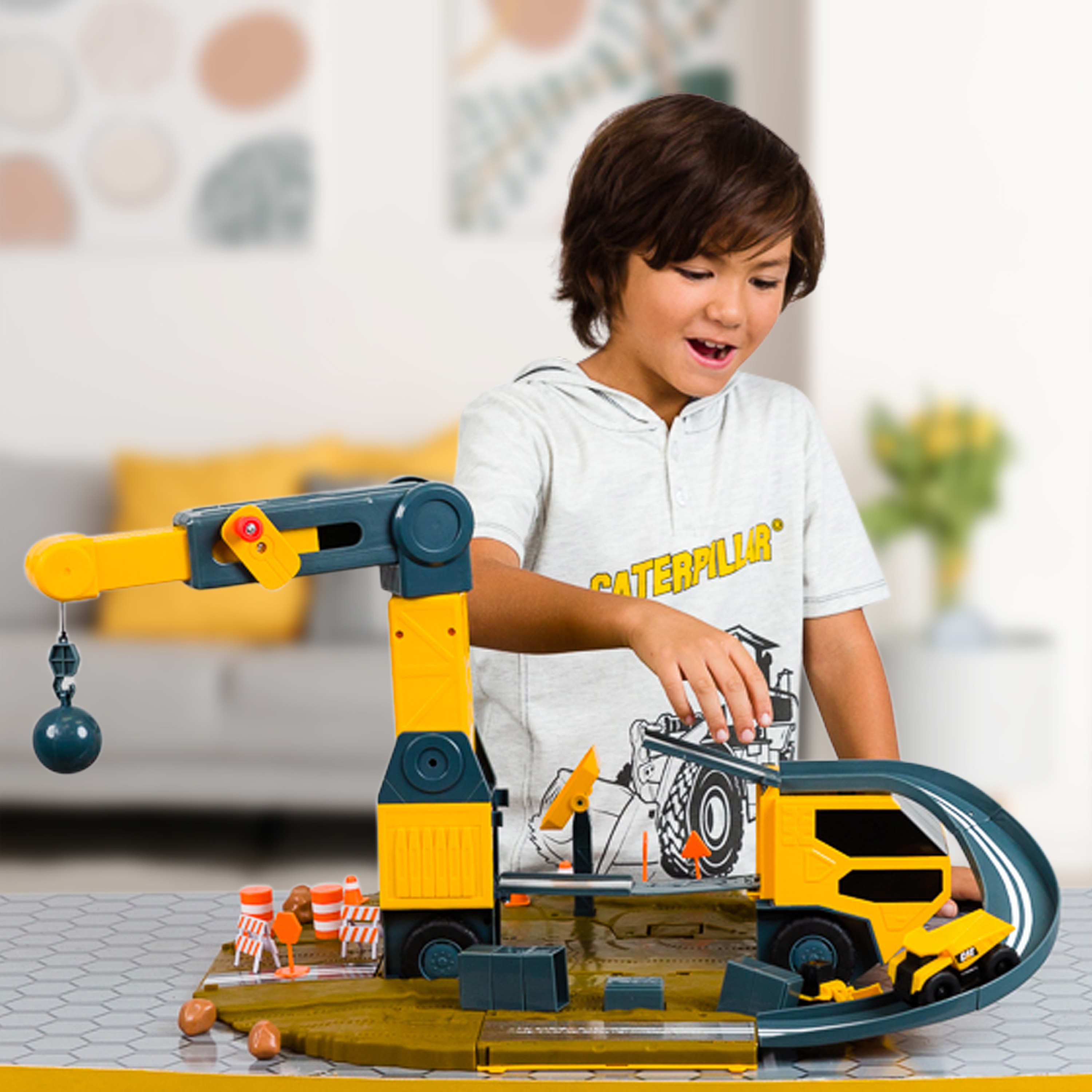 a child playing with the crane playset