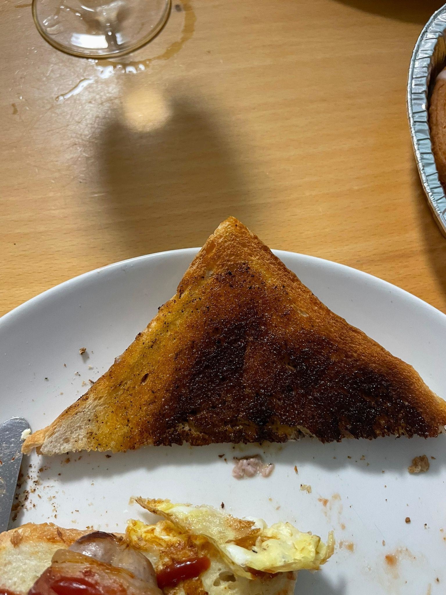 a triangle slice of burnt toast