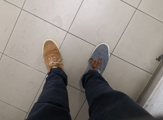 Guy wears two different shoes