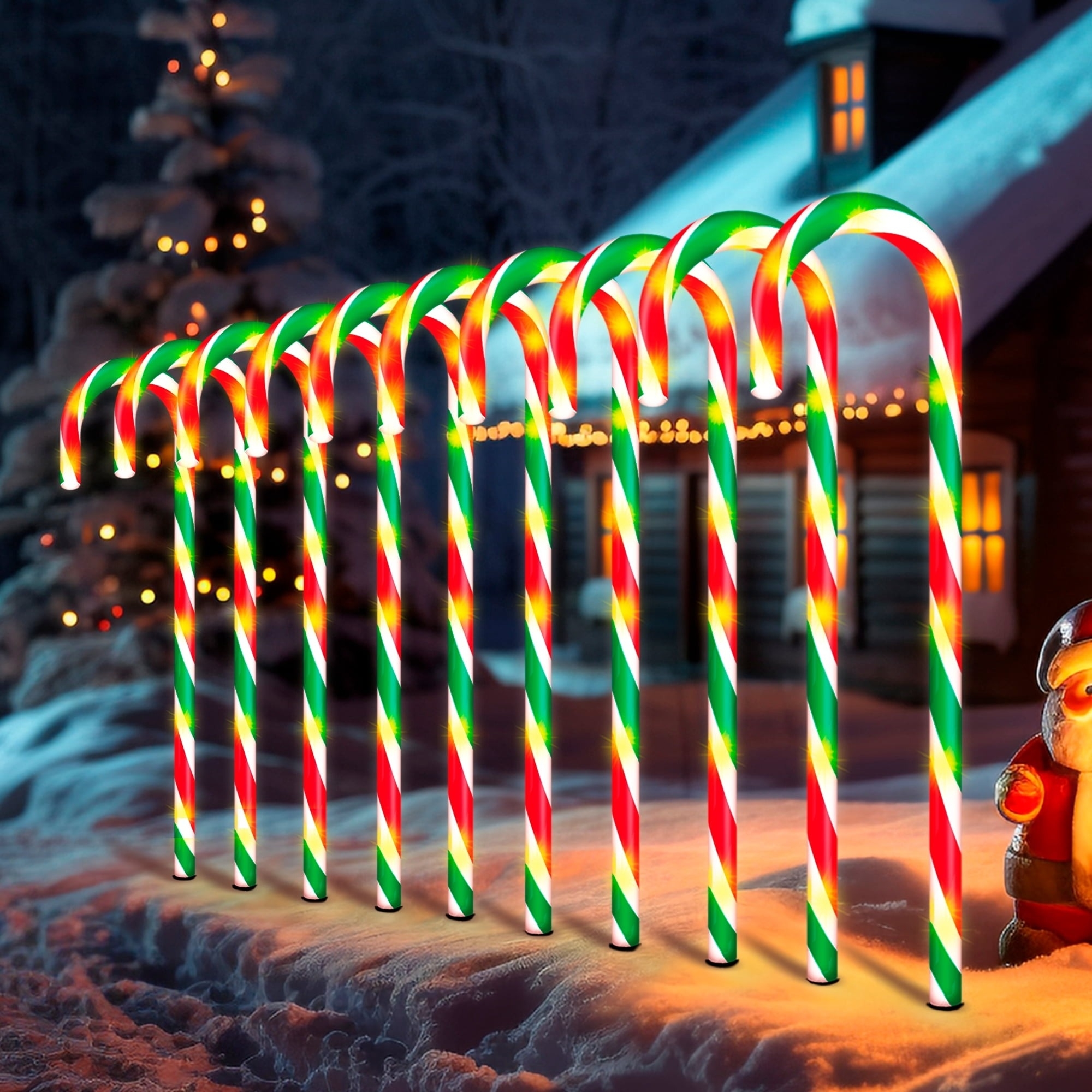 red, green, and white candy cane pathway lights at night